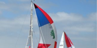 2 colorful boats of the 59 racing in the 8th Annual HospiceCare Benefit Regatta.jpg