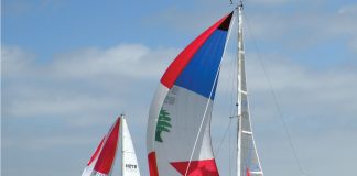 colorful boats of the 59 racing in the 8th Annual HospiceCare Benefit Regatta.jpg