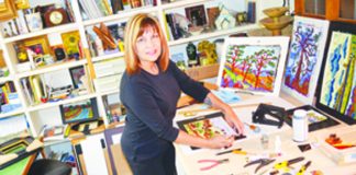 WEBPAINTERIn her La Mesa home office, Monica Straub frames and prepares clients' orders of her paintings..jpg