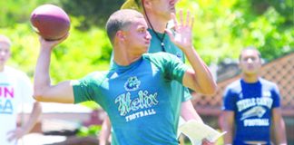 WEBHelix quarterback Michael Austin drops back under the watchful guidance of head coach Troy Starr. .jpg