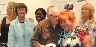 WWEBLynnette Wilson, at a retirement party celebrating her 43 years at Grossmont College, shares a joke with co-worker Bob Yochum..jpg