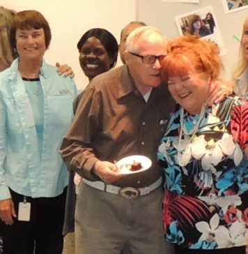 WWEBLynnette Wilson, at a retirement party celebrating her 43 years at Grossmont College, shares a joke with co-worker Bob Yochum..jpg